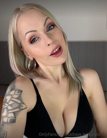 Tattoos legs nylons 1 image
